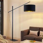 Arcchio välvd golvlampa Mossa, 200 cm, svart-guld, textil